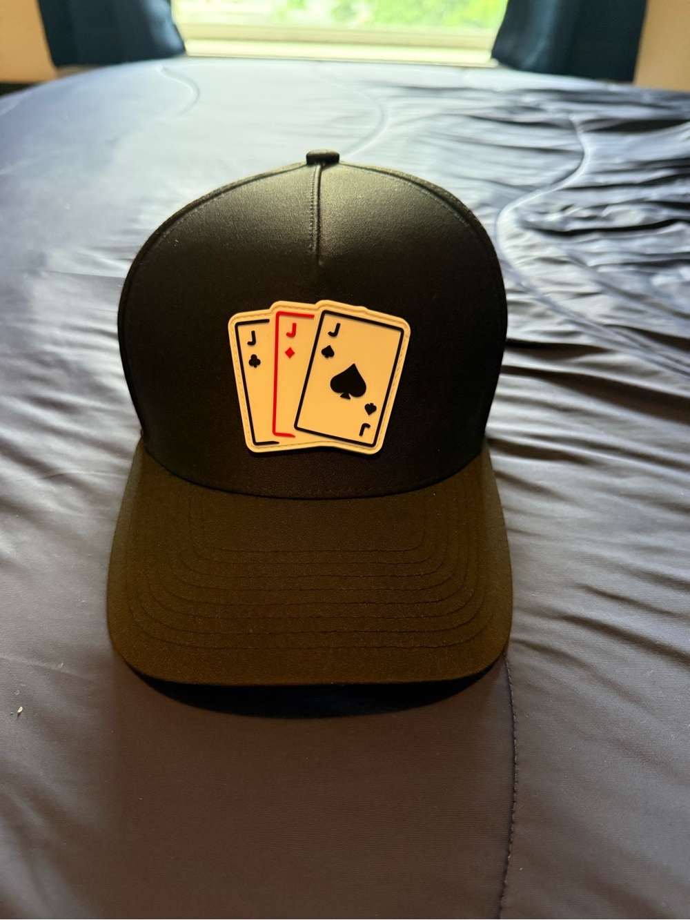 Black Waggle Trucker Hat with Playing Card Patch